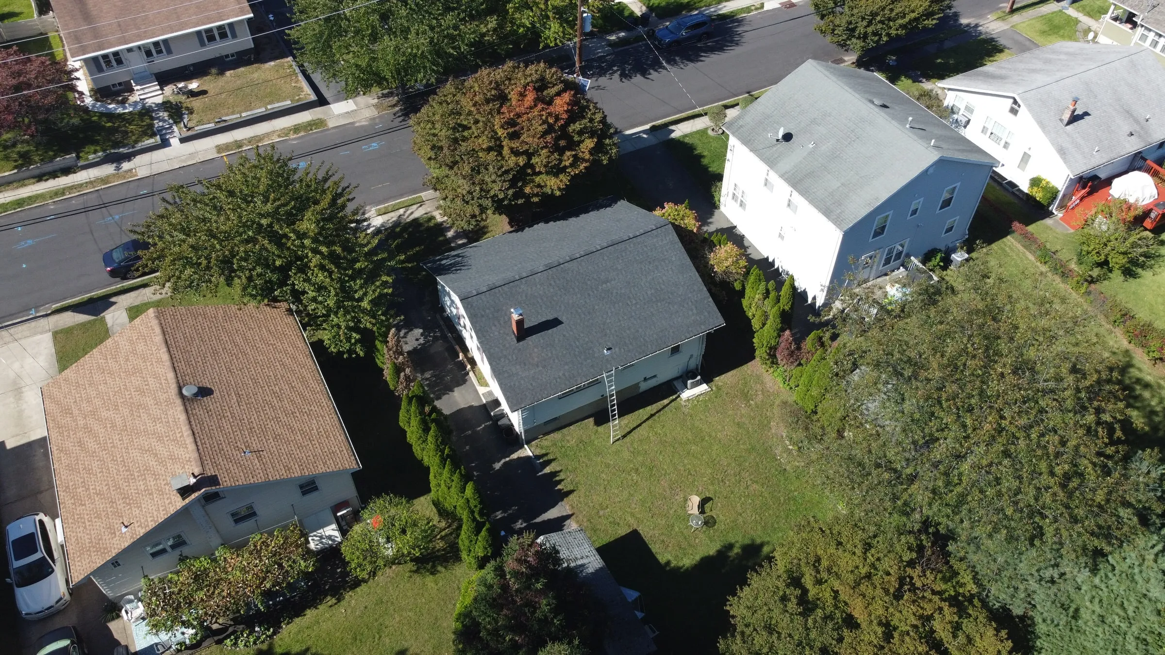 Street-side aerial of a completed roof replacement