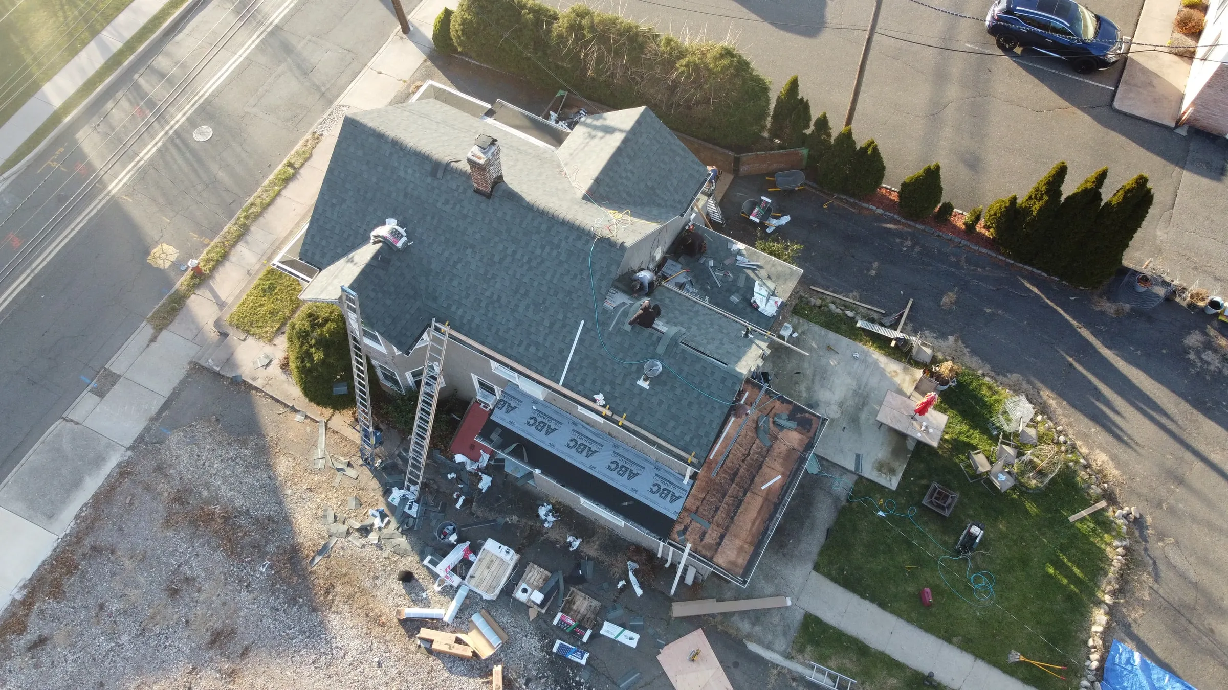 Drone view of a Titan crew re-roofing a two-story home